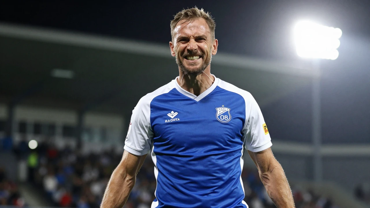Waist-up shot of a strong, mid-aged Sarpsborg 08 player in blue and white strip, celebrating with a fierce grin