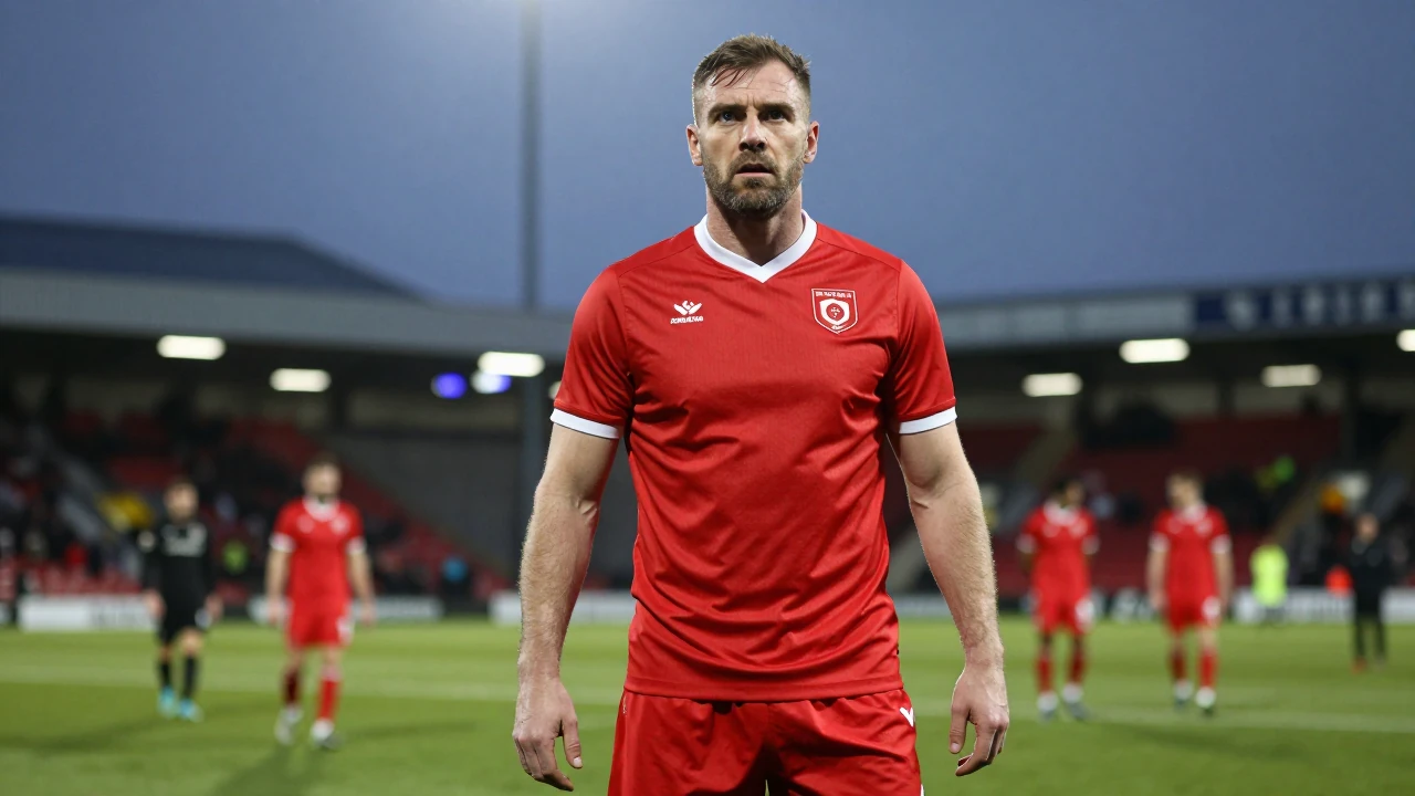 Floodlight rim light: A burly Oldham Athletic coach in bright red strip, eyes locked and intense, preparing to lead his...