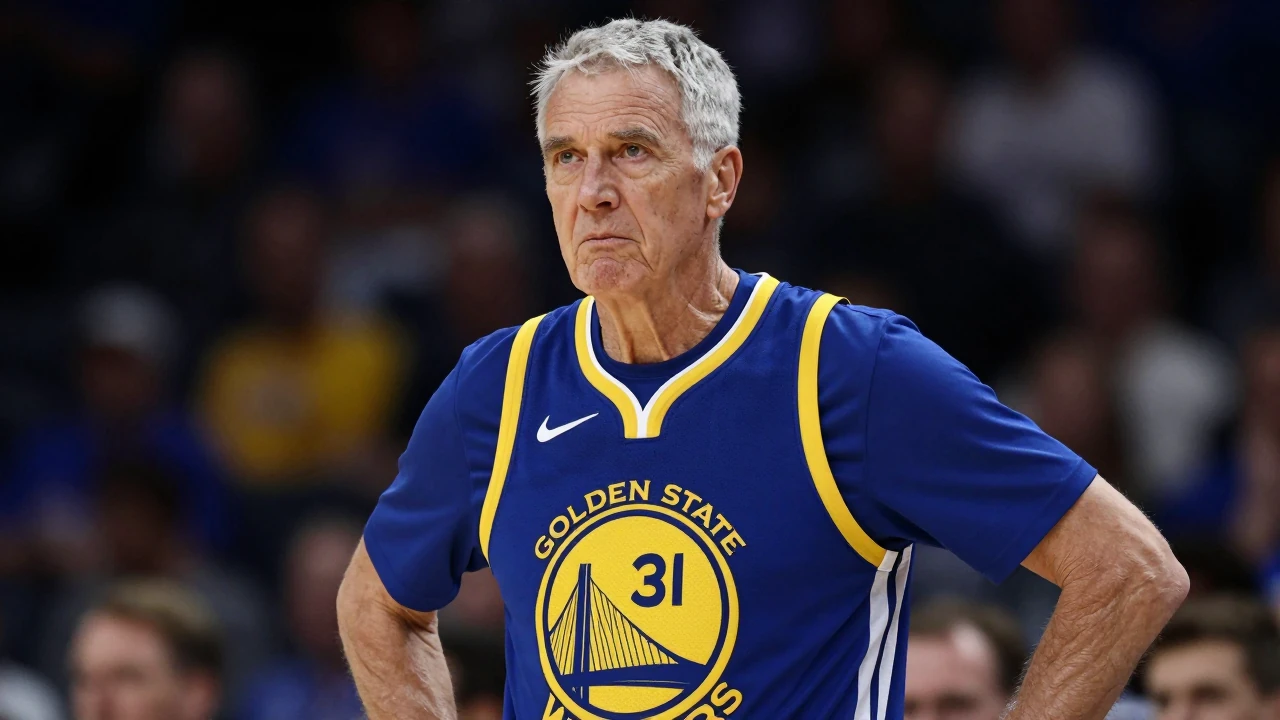 Elderly male coach, mid-70s, lean build, silver-gray hair, thoughtful expression, wearing Golden State Warriors home...
