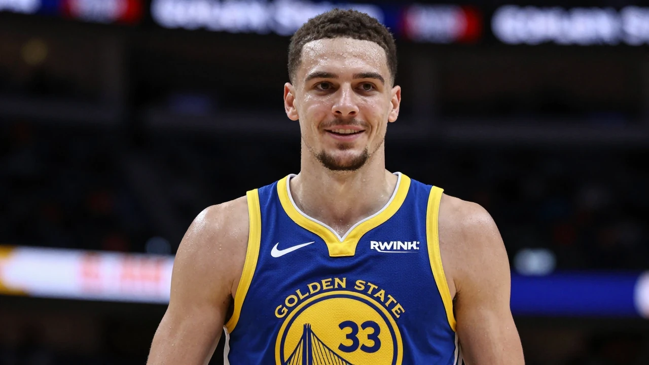Mid-shot of a 22-year-old muscular forward in a Golden State Warriors home jersey, royal blue with gold trim and the...