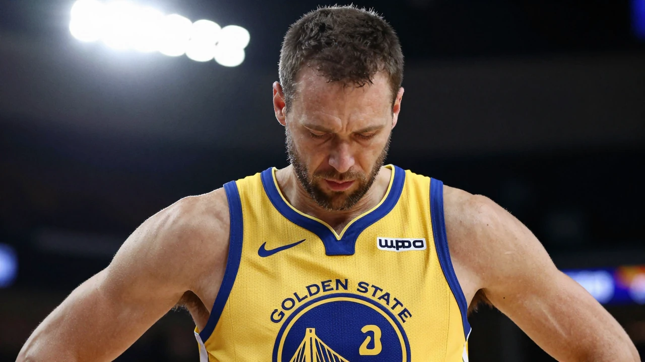 A frustrated 40-year-old Warriors coach, in a gold home kit with navy blue trim, looks down with a mix of disappointment...