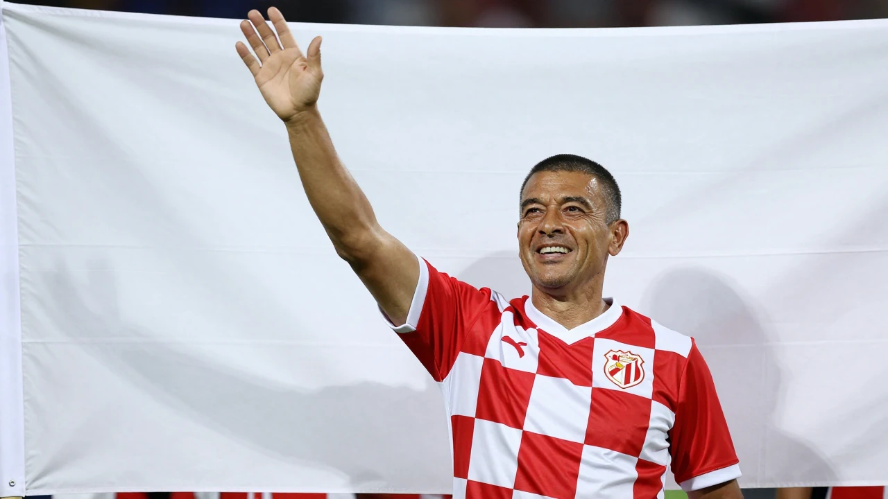 Waist-up shot of an anonymous middle-aged supporter, wearing a clean solid block of red and white checkered jersey, his...