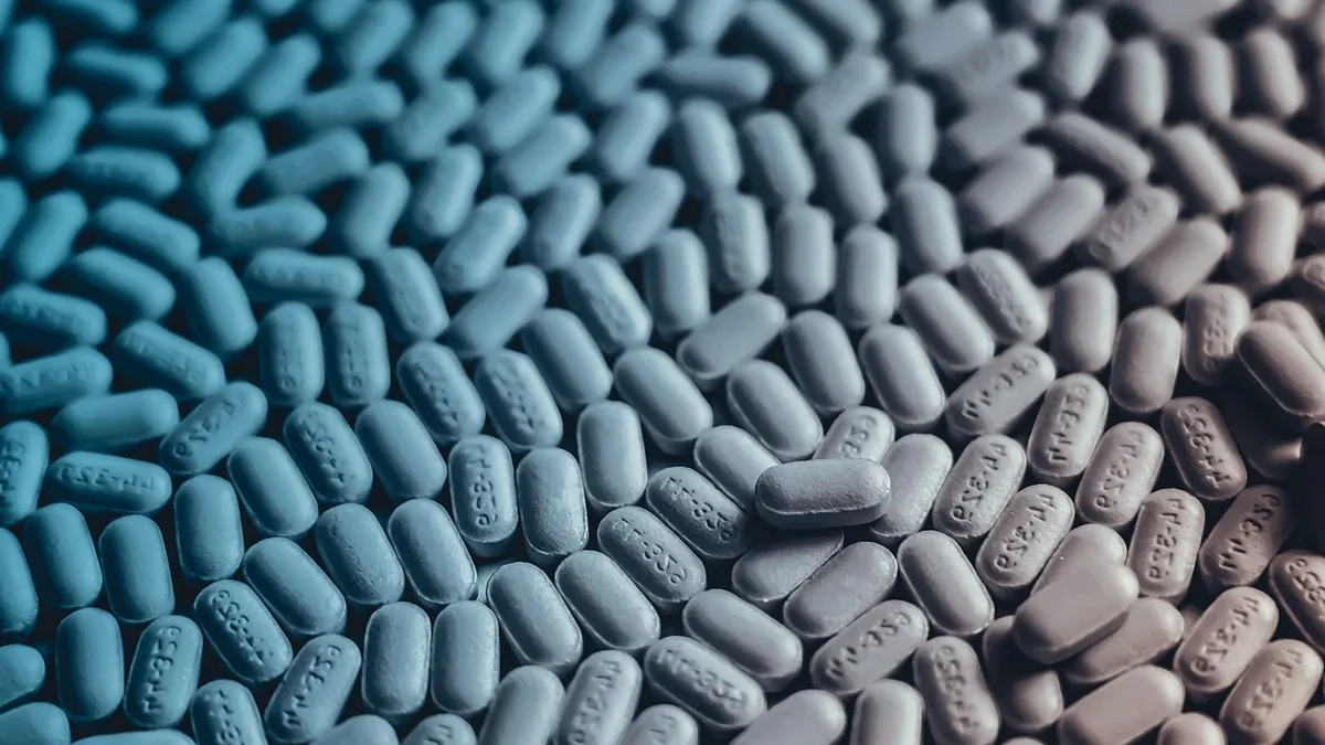 Evidence: A large quantity of small, oblong pills with the word "XANAX" embossed on them, scattered in a disorganized manner.
