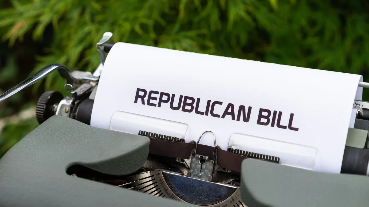 Policy Areas: Typewriter displaying 'Republican Bill' in an outdoor setting.