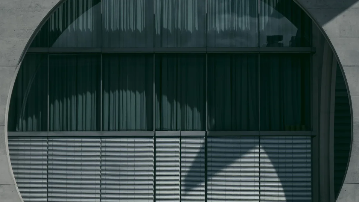 Elections: Man walking by the circular facade of Marie-Elisabeth-Luders House in Berlin.