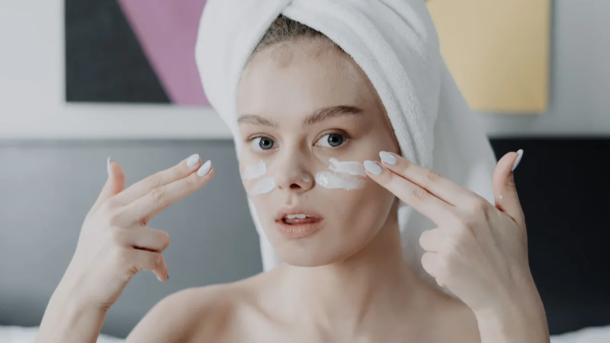 Allure's guide highlights creams with retinoids and peptides for firmer-looking skin, noting they work over time, not...