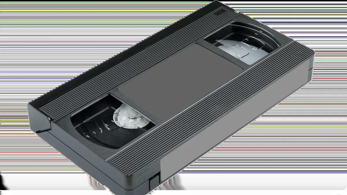 Films: A VHS tape, which is a type of video cassette that was used to play home movies and other video content.
