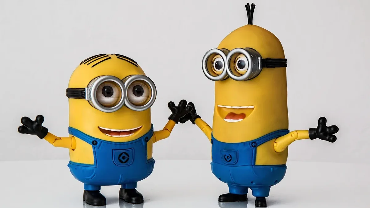 Industry: Two Minions from the Despicable Me franchise, standing side by side and facing the camera.