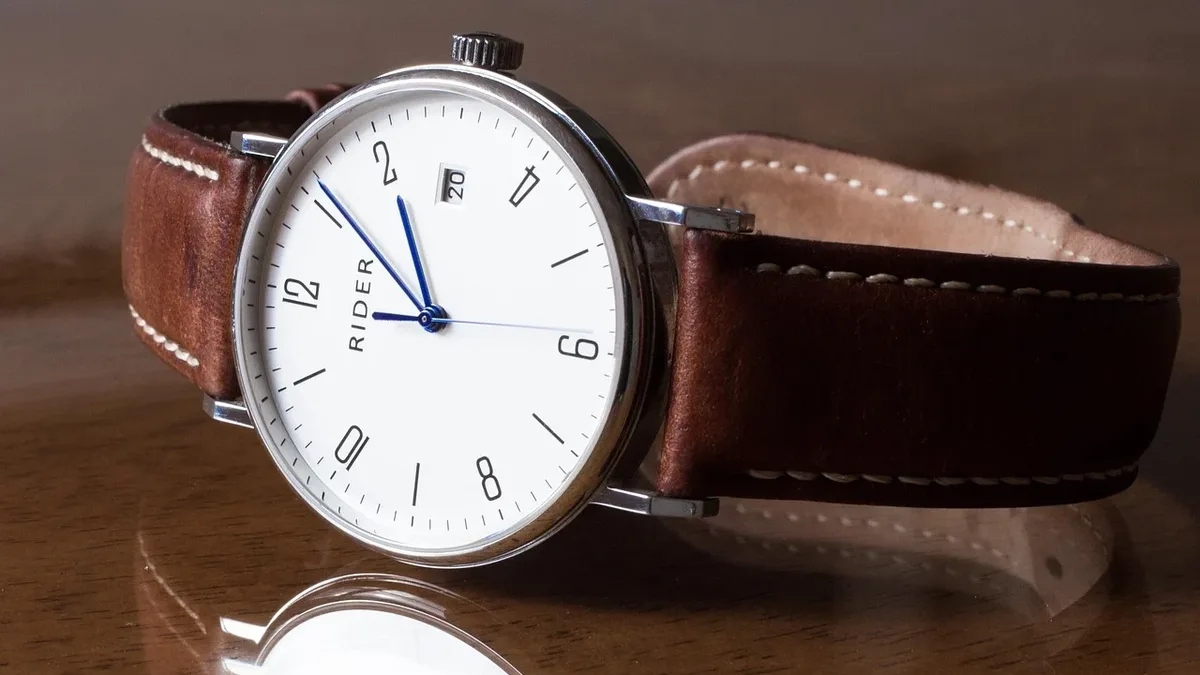 A watch enthusiast publication compares the Orient Star Sakigake Three Hand and Tissot Gentleman 38mm, detailing design...