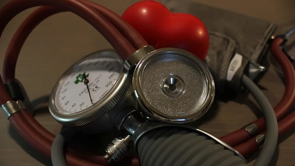 Care Systems: A blood pressure cuff, a sphygmomanometer, and a red heart-shaped object are visible.