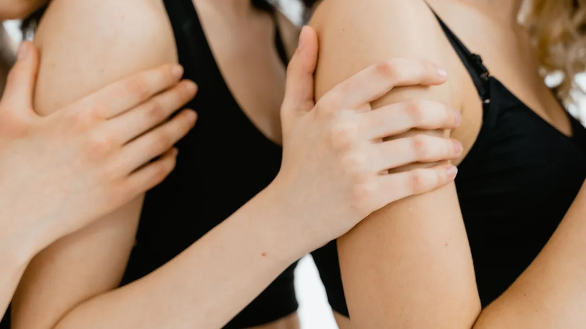 Care Systems: Intimate close-up of three women holding each other, showcasing unity and support.