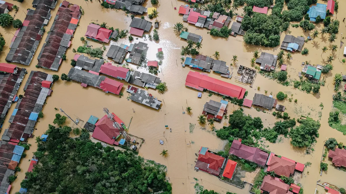 Record flooding in Indiana has killed seven people, destroyed infrastructure, and left over 1,000 homeless, with damage...