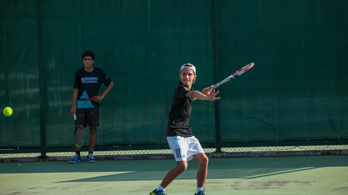 Tournaments: Young man plays tennis on outdoor court in Guadalajara, Mexico.