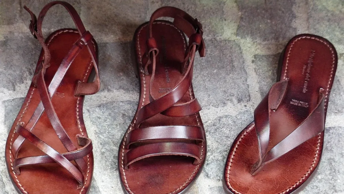 A fashion guide crowns the Birkenstock Arizona as the top men's sandal, praising its comfort and versatility, while...