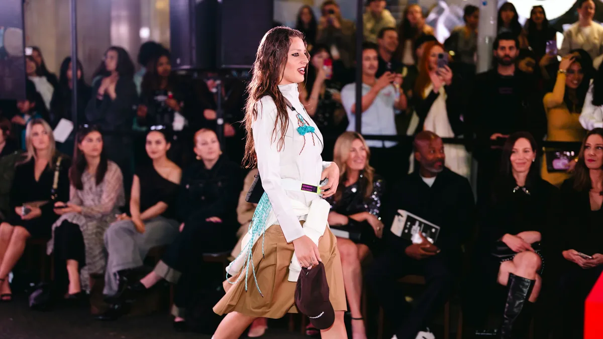 Designer Liza Keane presented her apocalyptic 'Rain On My Parade' collection for SS27 at London Fashion Week, featuring a...