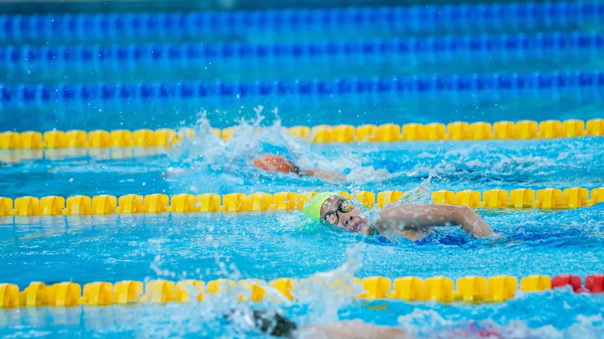 The Fishers Area Swimming Tigers have hired former Indiana and Michigan collegiate standouts MacKenzie Looze and Kyle...