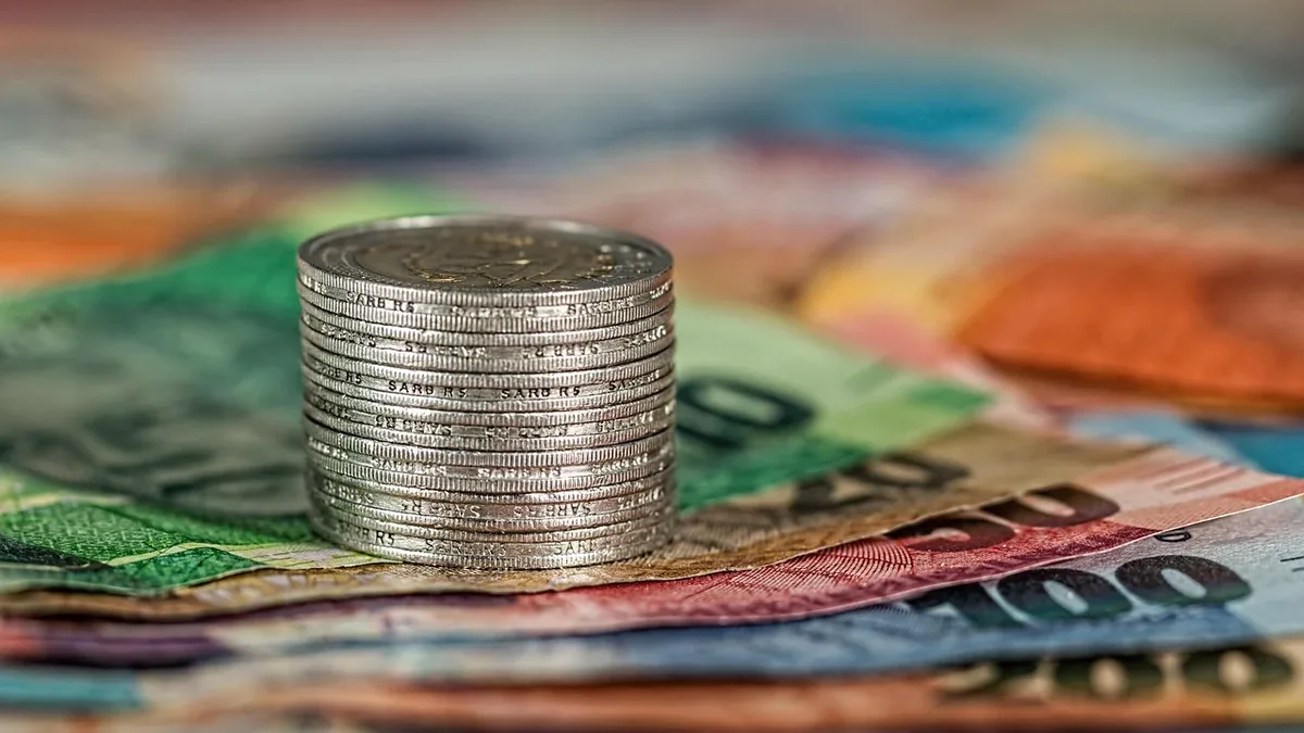 Labour Market: Coins, banknotes, money, currency, finance, cash.