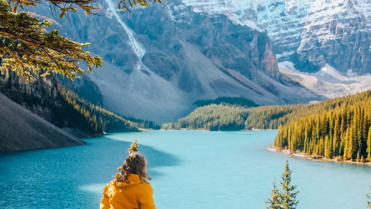 A hiker faces a daunting challenge as they enter the White Mountain National Forest, preparing for a steep climb up Mount...