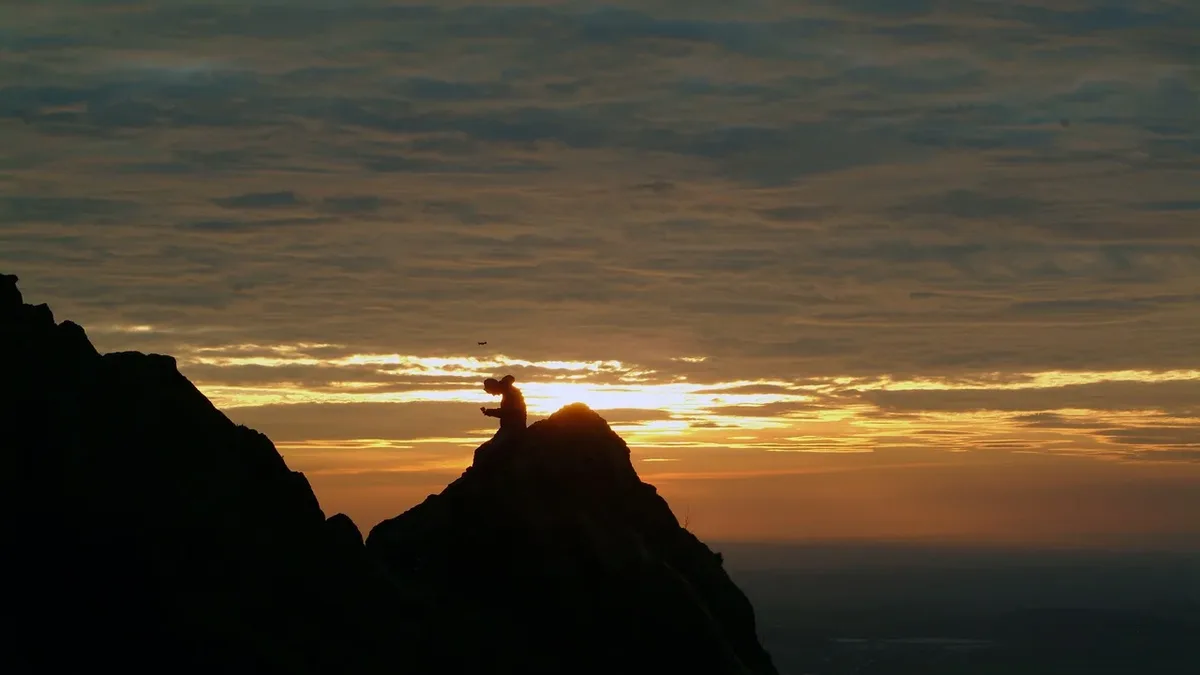 Turkenna, a thru-hiker on the Appalachian Trail, finished her 1700-mile trek by summiting Killington Peak at sunrise