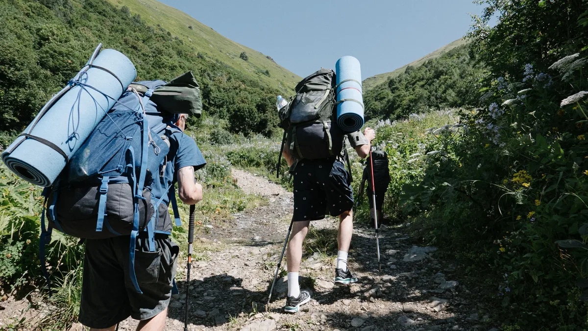 A group of Pacific Crest Trail hikers, including Helium and Punisher, reached the trail's halfway marker after 82 days...