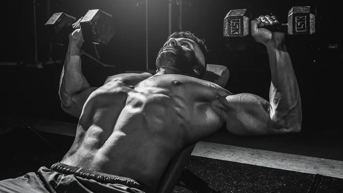 Men's Health details the Y-press, a shoulder exercise that uses lighter dumbbells by pressing them outwards to increase...