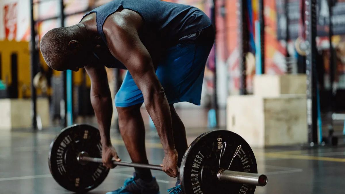 Coach Alain Gonzalez outlines five simple fitness tests for men over 40, assessing grip strength, balance, and core stability