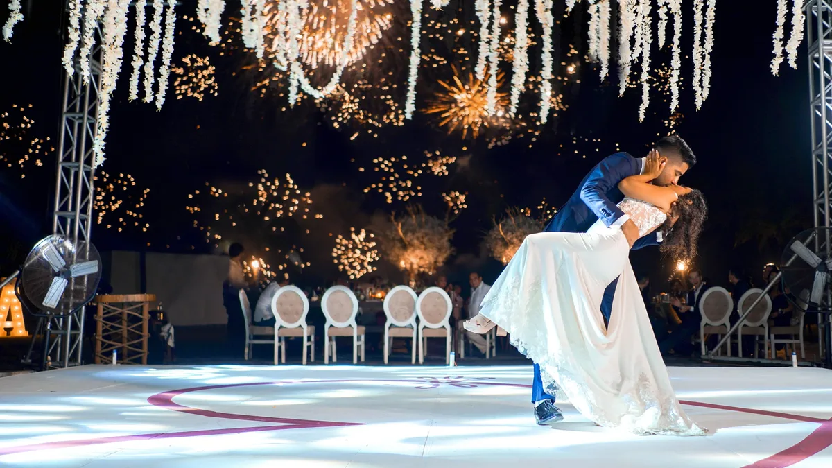A couple held a vibrant, culturally-rich wedding at Portugal's Estoril Vintage Hotel, featuring vintage chandeliers, a...