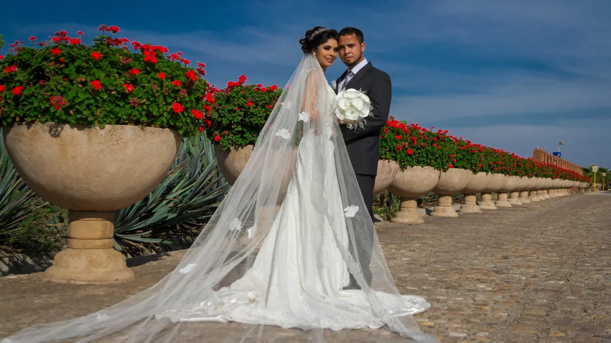 Caroline and Wes incorporated their prom crowns into their whimsical garden wedding reception, a surprise gift from the...
