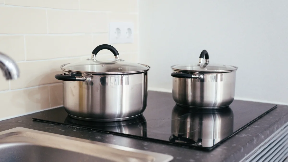 Serious Eats breaks down the major All-Clad stainless steel cookware lines, comparing tri-ply and 5-ply construction