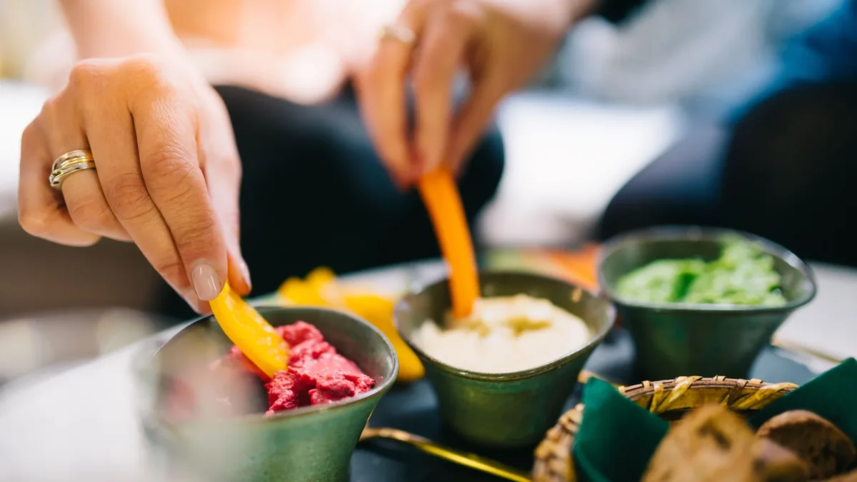 Allrecipes editor Catherine Jessee compiles a dozen dip recipes designed for a 9x13-inch dish, perfect for feeding a...