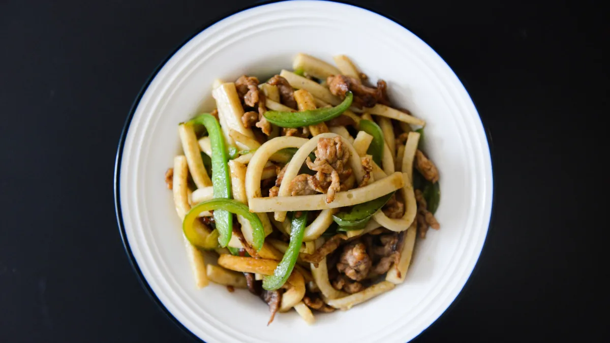 A recipe for a quick stir fry using pork belly and yu choy, where the seared pork provides both flavor and cooking fat