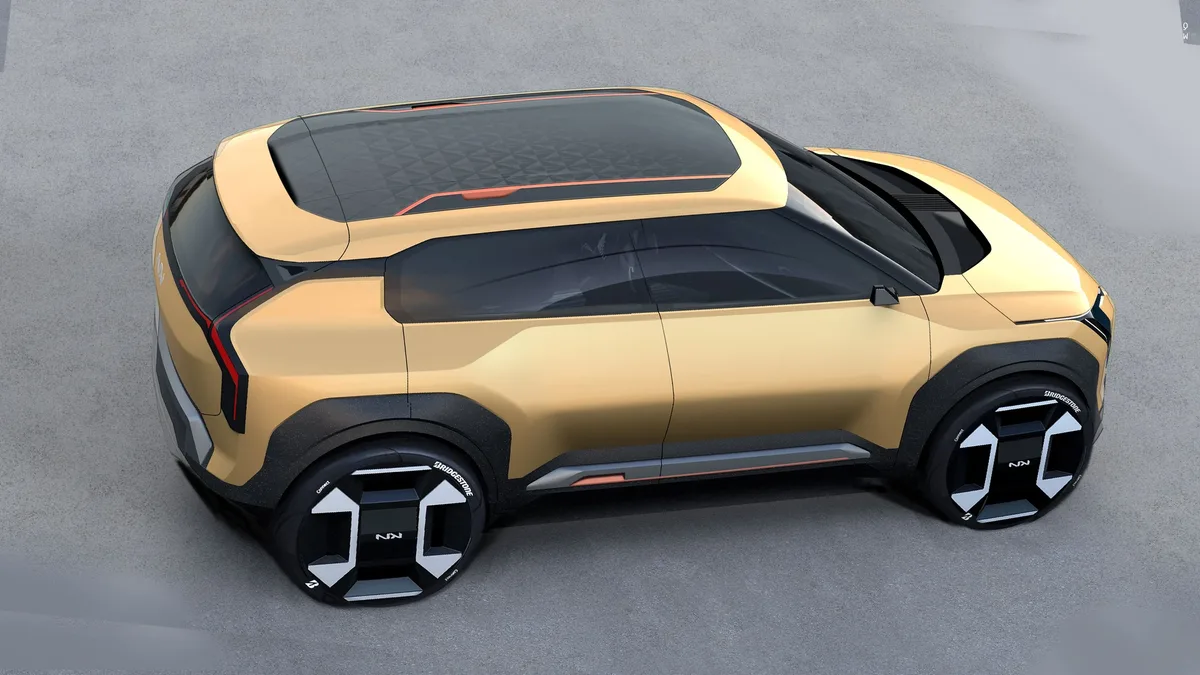 Safety: Futuristic gold concept car design showcasing modern electric vehicle features.