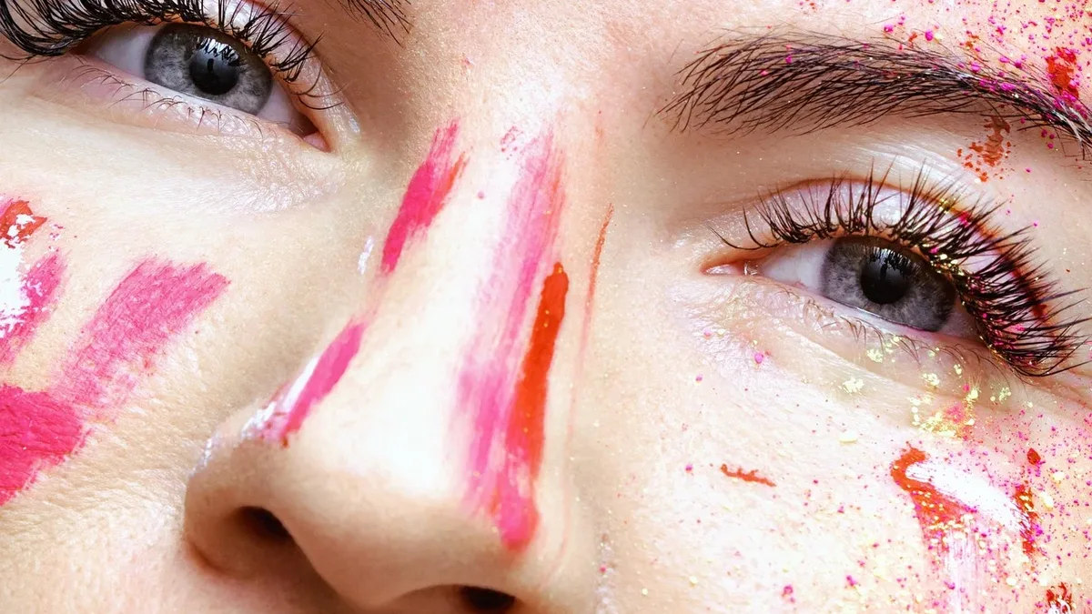 London Fashion Week SS27 featured experimental beauty looks focusing on skin texture, from Di Petsa's 'milky' wet-look...