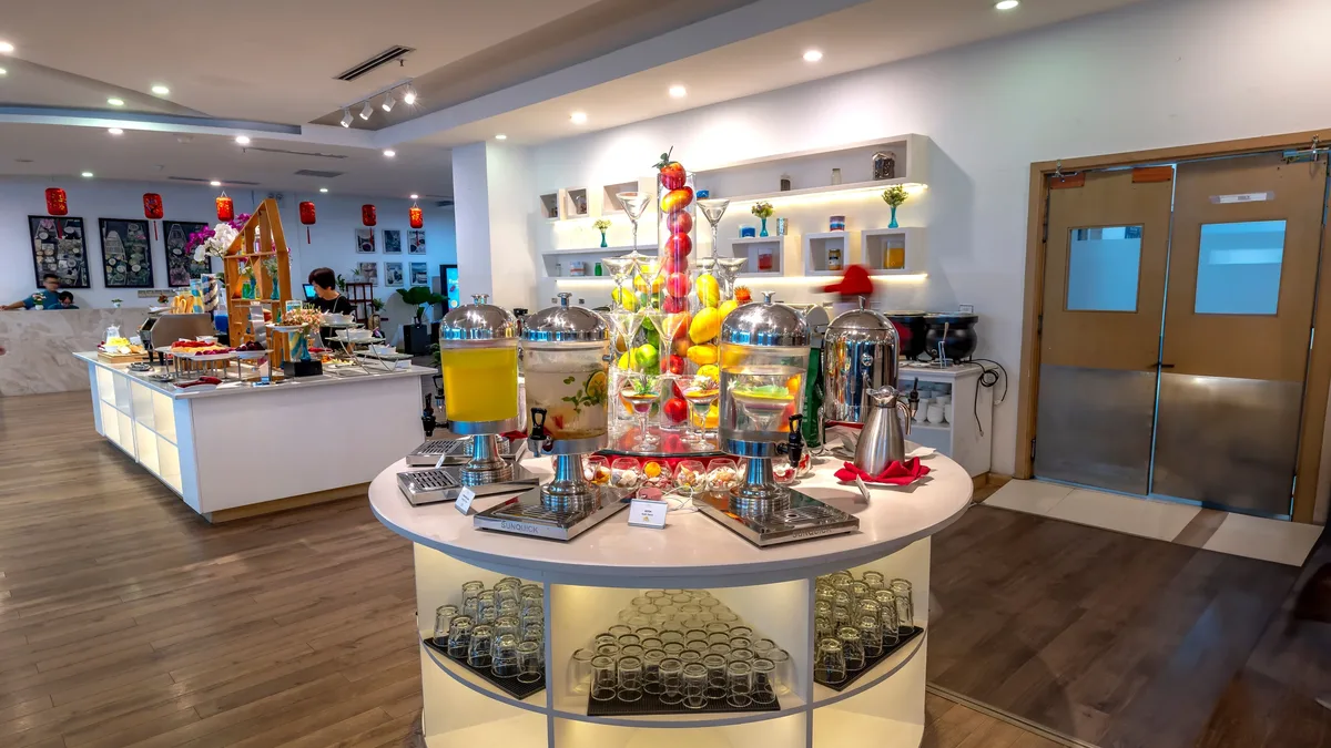 Luxurious buffet display with diverse food and beverages in a modern hotel setting. Restaurants & Dining professional
