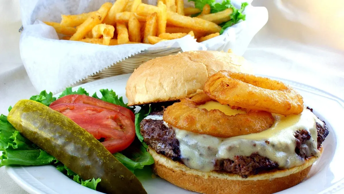 Customer reviews rank Burger King's onion rings as the best in fast food, while the chain tests a new version with whole...