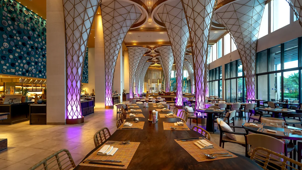 Cities: Spacious modern restaurant interior with unique ceiling design and ambient lighting. Restaurants & Dining