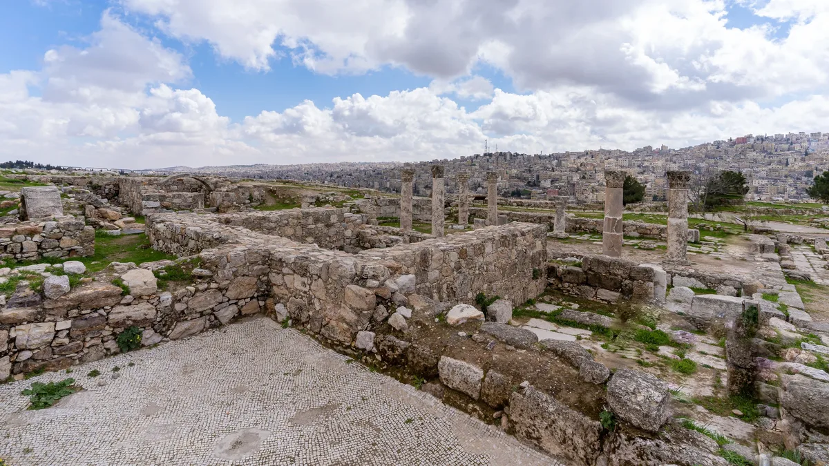 Explore the historical Amman Citadel ruins with ancient stone structures and panoramic city views. Archaeology professional