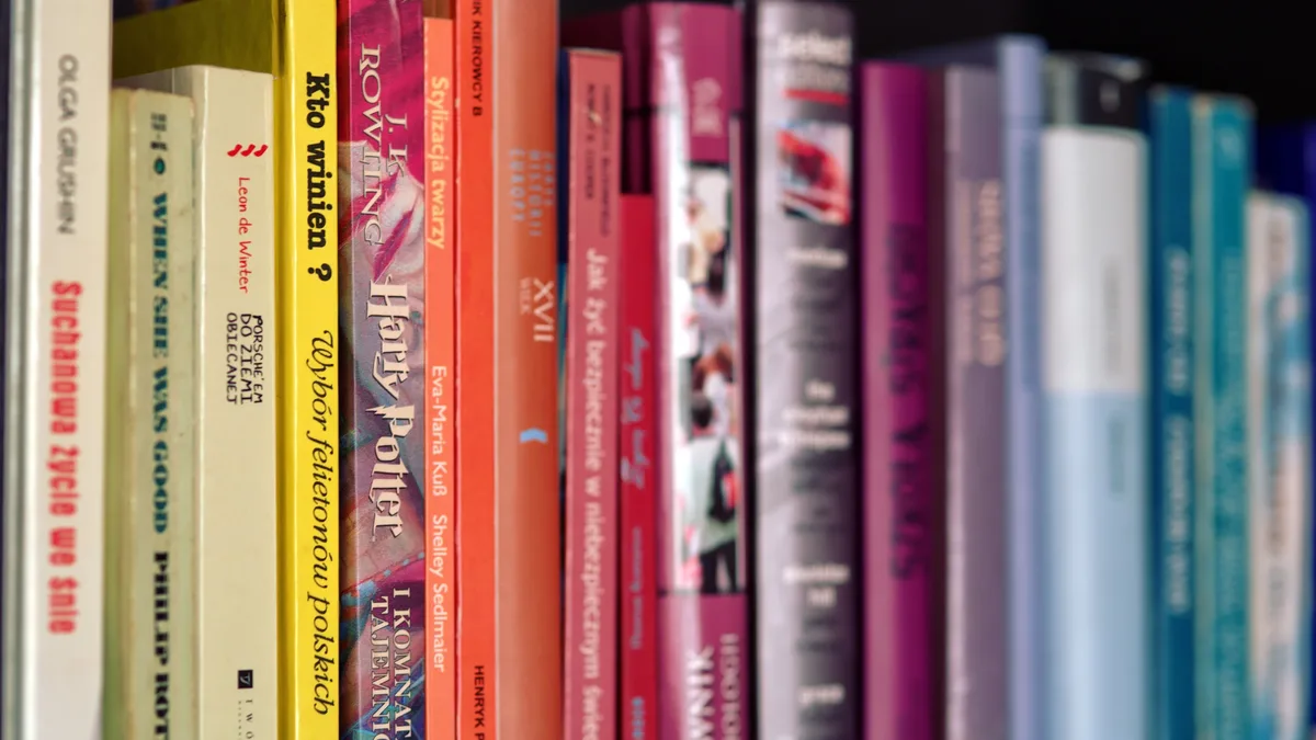 Authors Publishers: A row of books on a shelf, with the spines facing forward and the titles and authors visible.