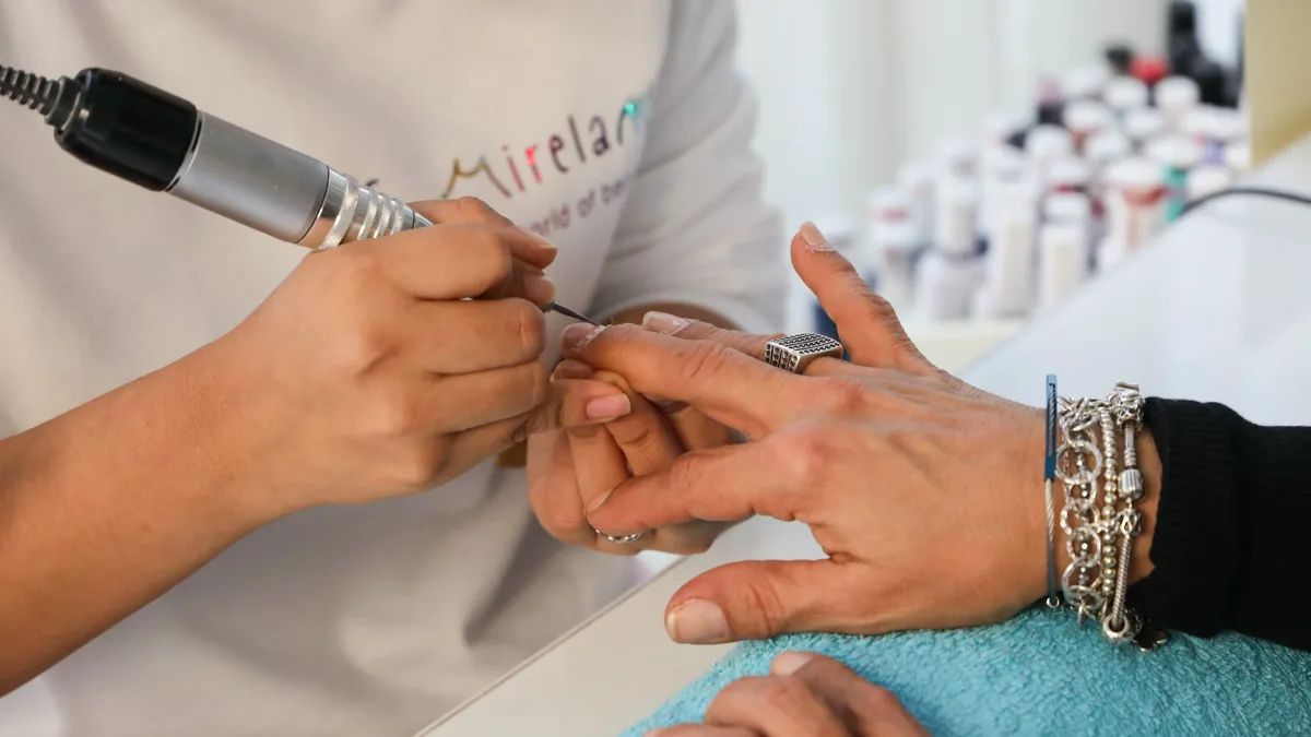 Nail technicians risk permanent contact dermatitis from skin exposure to uncured acrylates in gel and e-file dust, with...