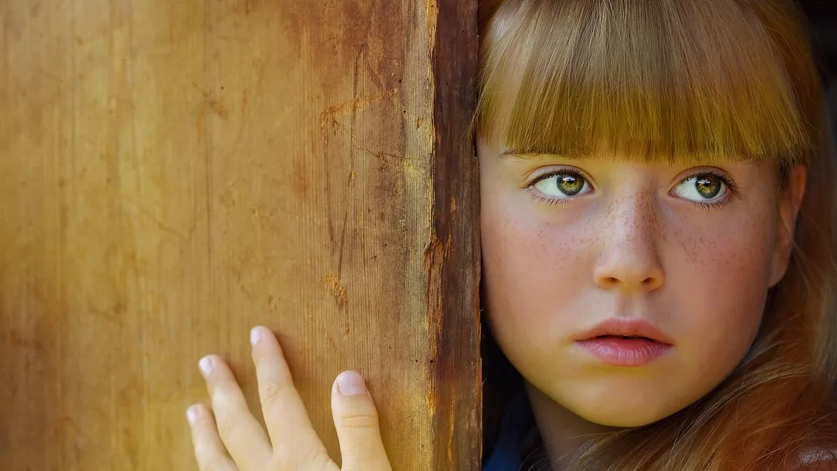 Themes: Person, human, girl, face, eyes, wood. Human Rights close up